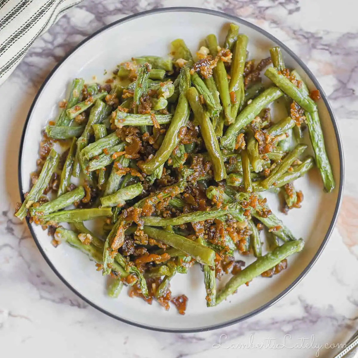 crack green beans on a plate.
