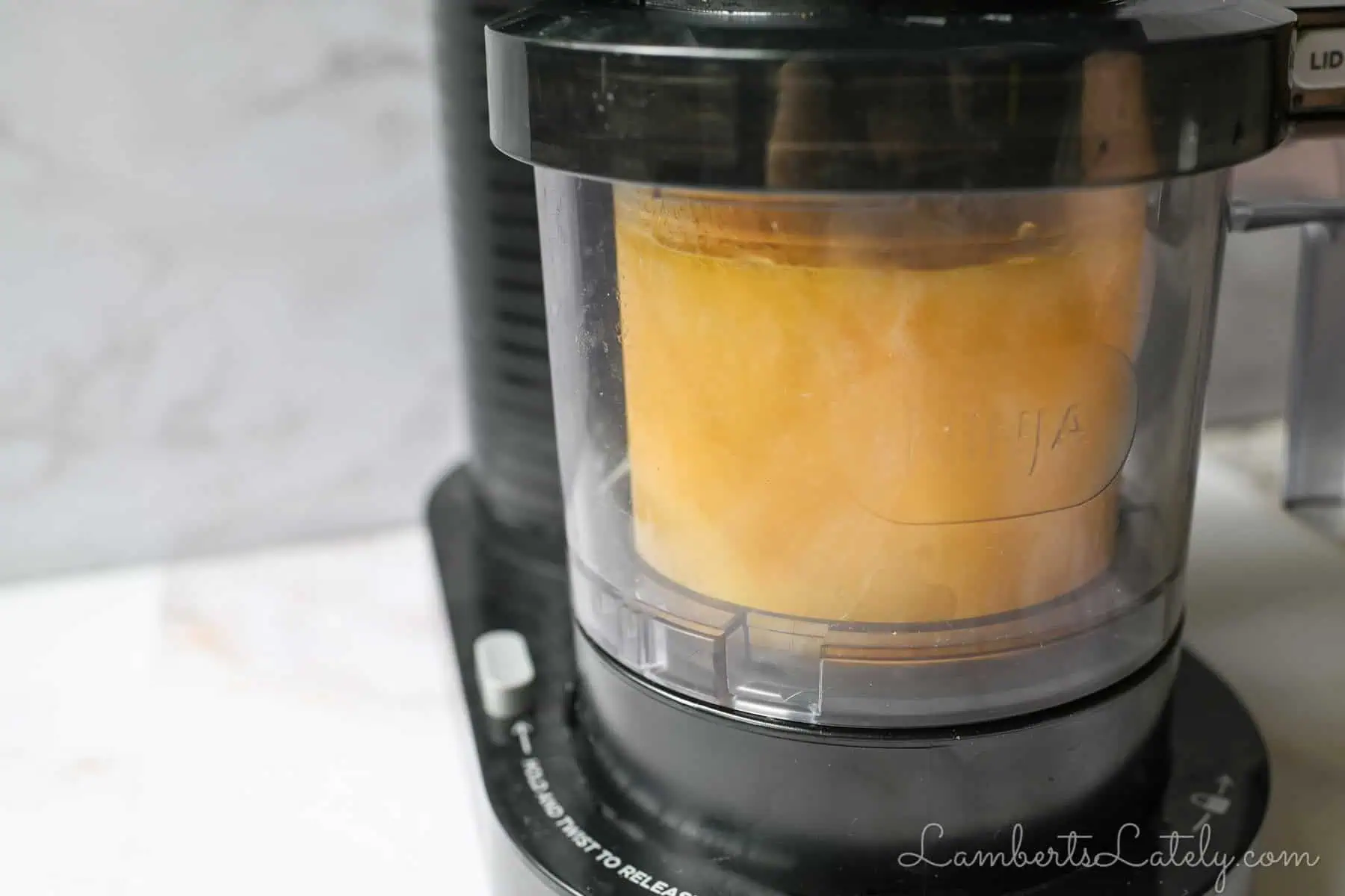 mango sorbet in a ninja creami machine.