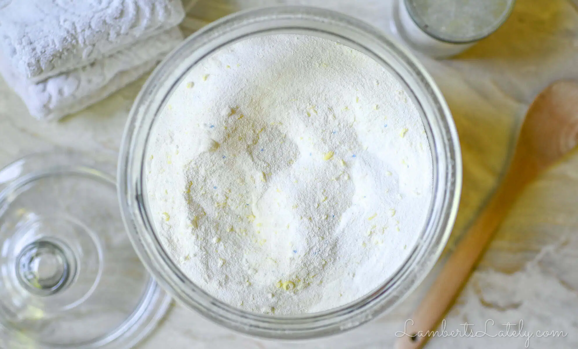 looking down at a large jar of diy laundry detergent powder.