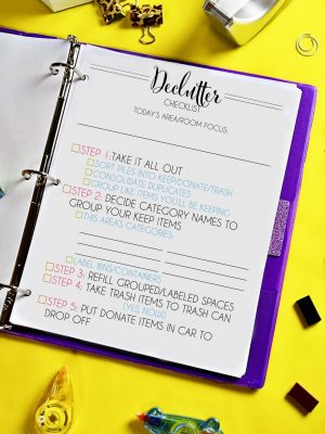  declutter checklist in a notebook.
