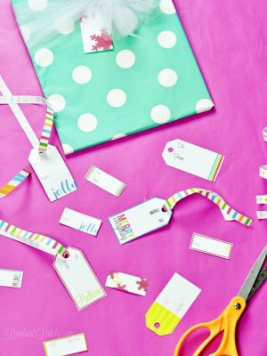 gift tags spread around gift wrapping supplies.