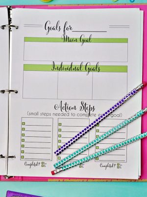 goals printable in a notebook, with pencils.