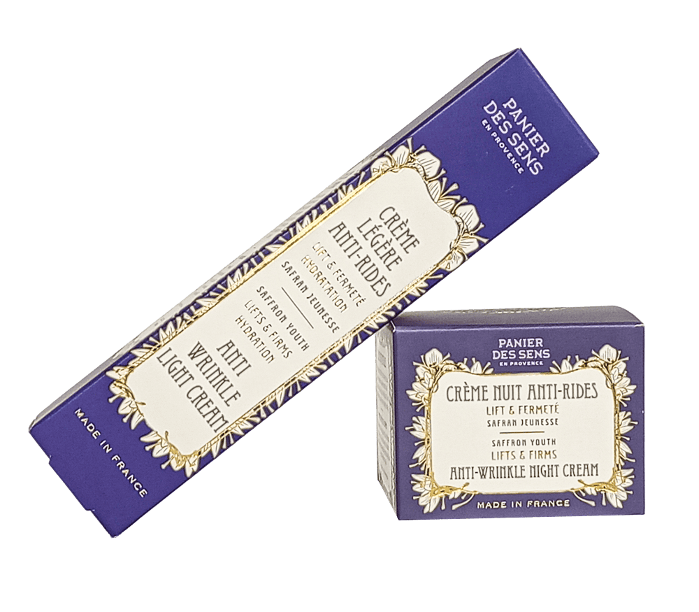 Crema nocturna antiarrugas en envase elegante con diseño en tonos azules y dorados.