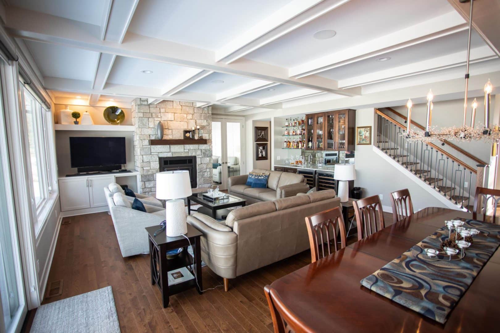 Spacious living room with modern decor and cozy fireplace in Livingston Homes.
