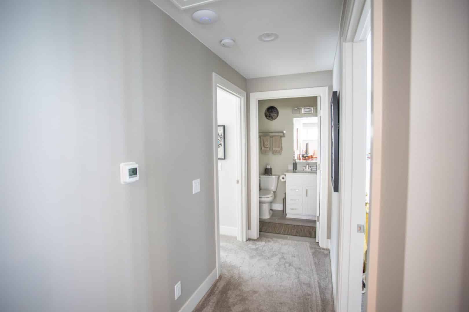 Bathroom interior with white fixtures and clean design.