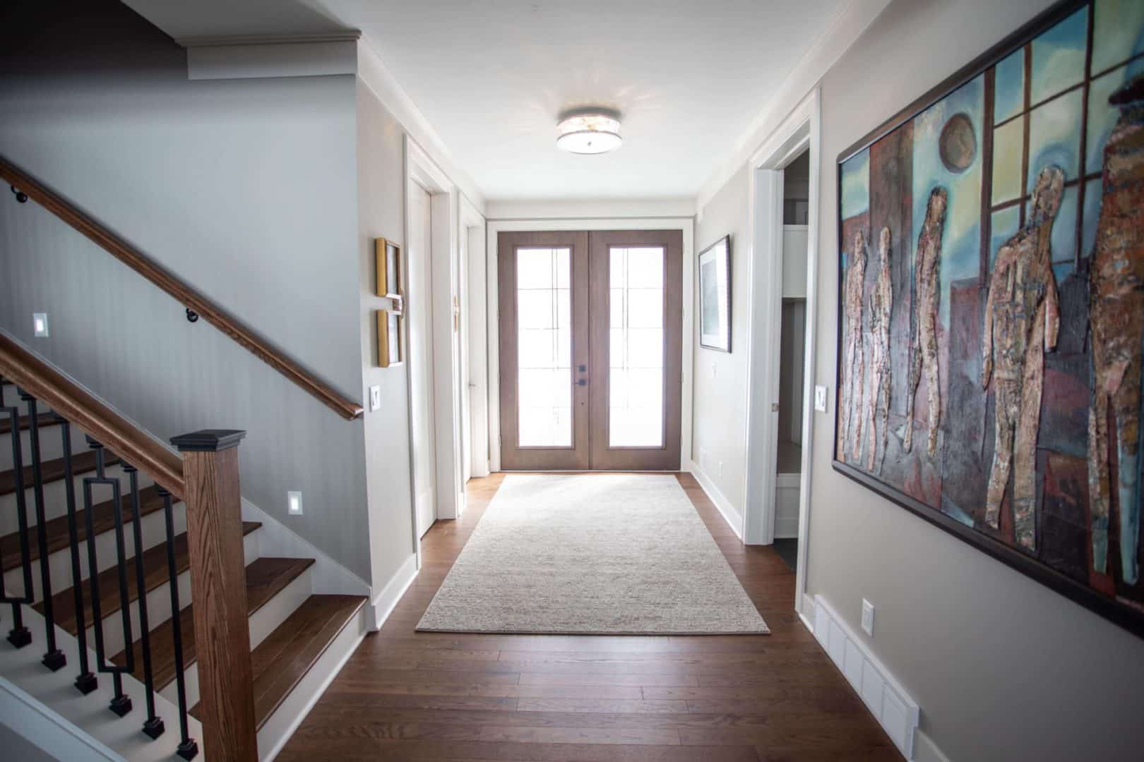 Spacious and welcoming entryway with modern decor and natural light.