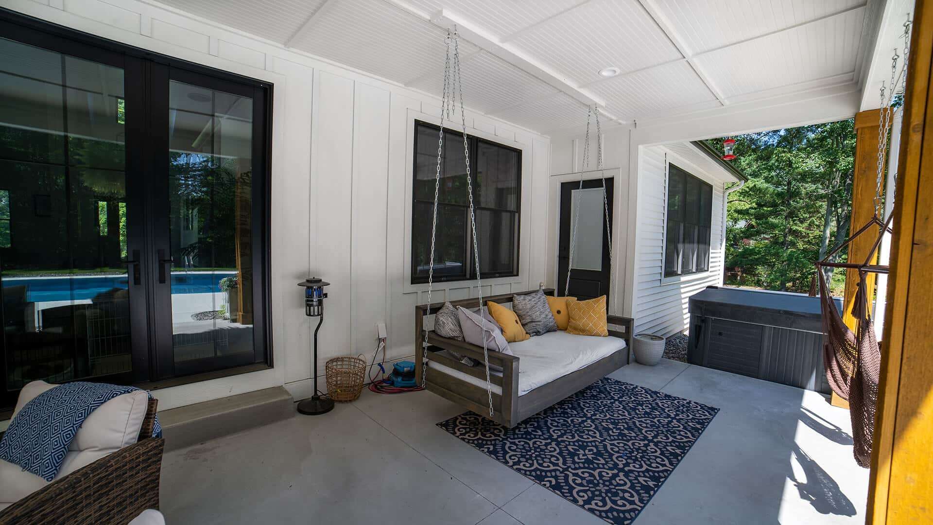 Sunroom with comfortable seating and large windows at Livingston Homes.