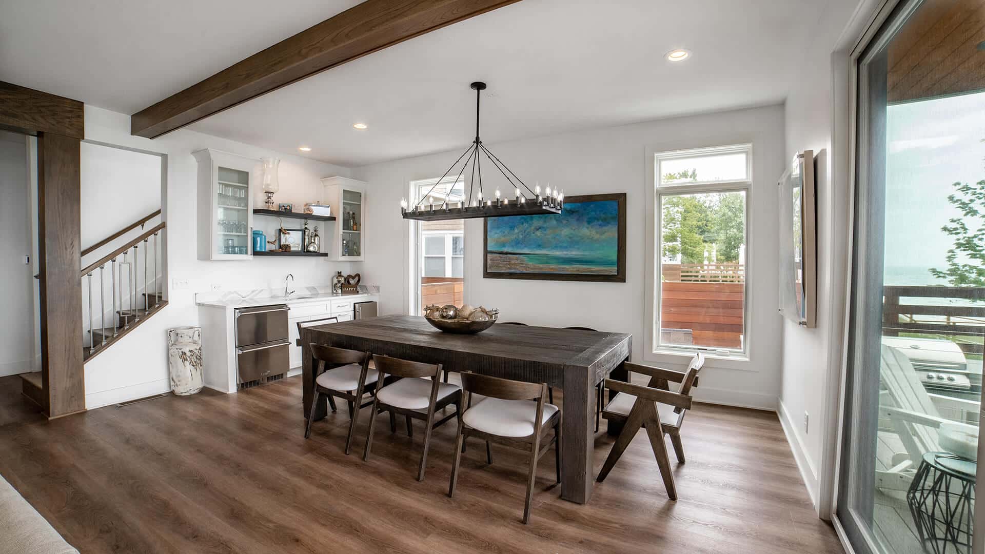Livingston Homes modern living and dining room with large windows and stylish decor.