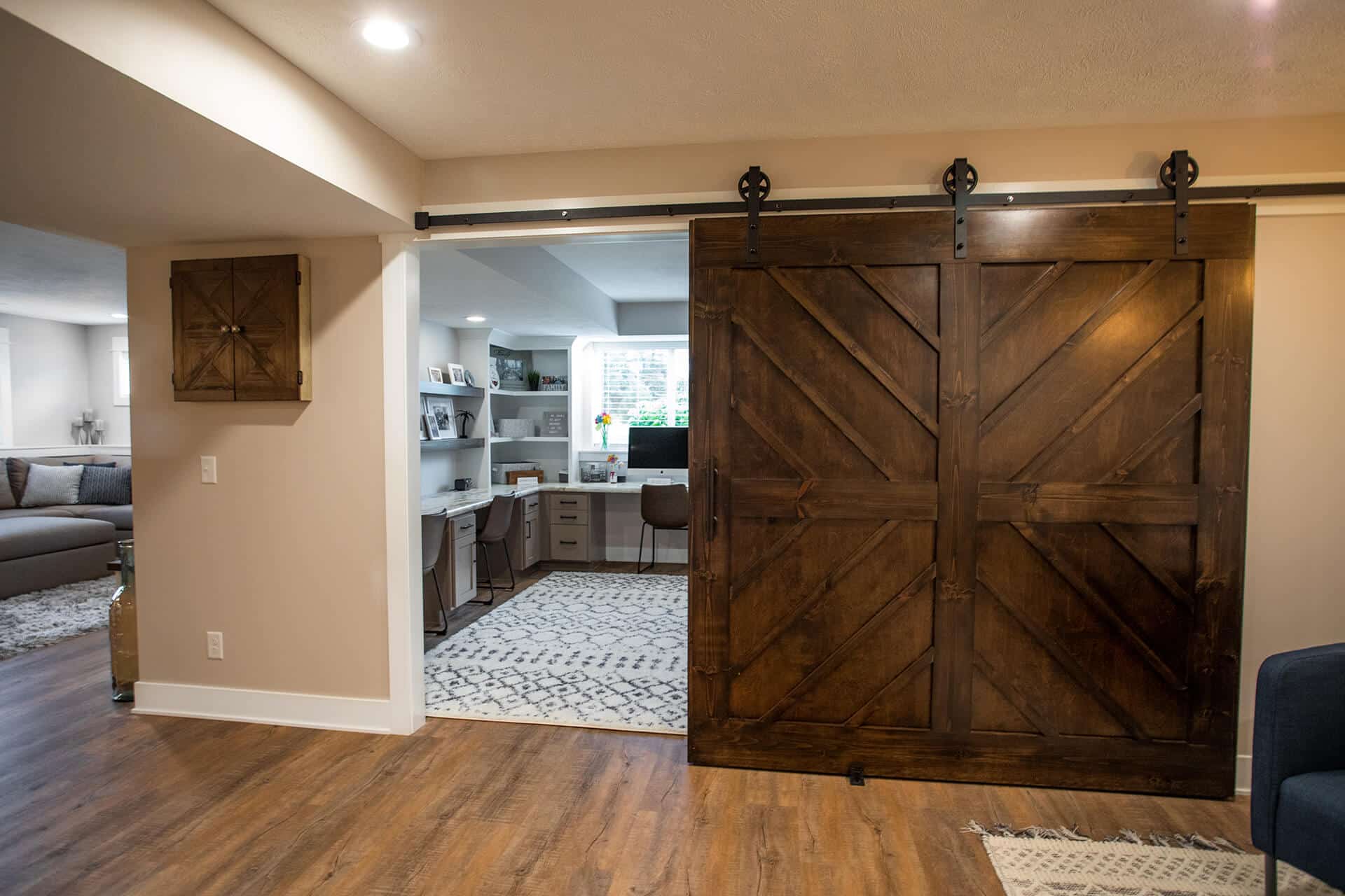 Barn door interior design in Livingston Homes property.