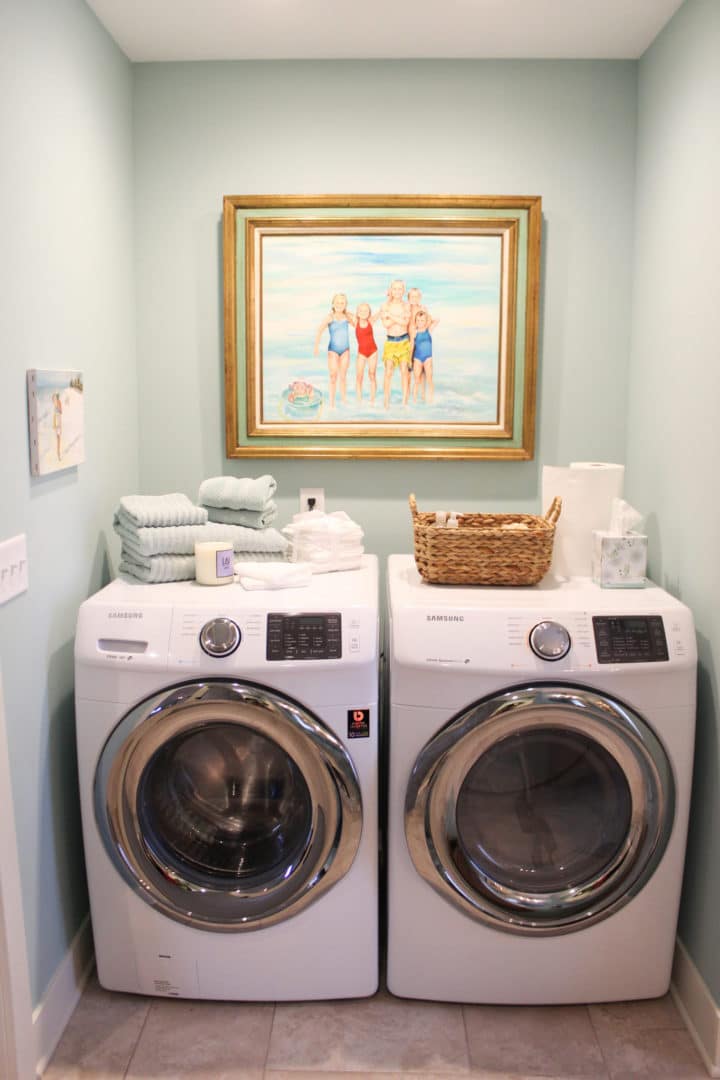 Efficient laundry area featuring front-loading washing machine and dryer in a cozy home.
