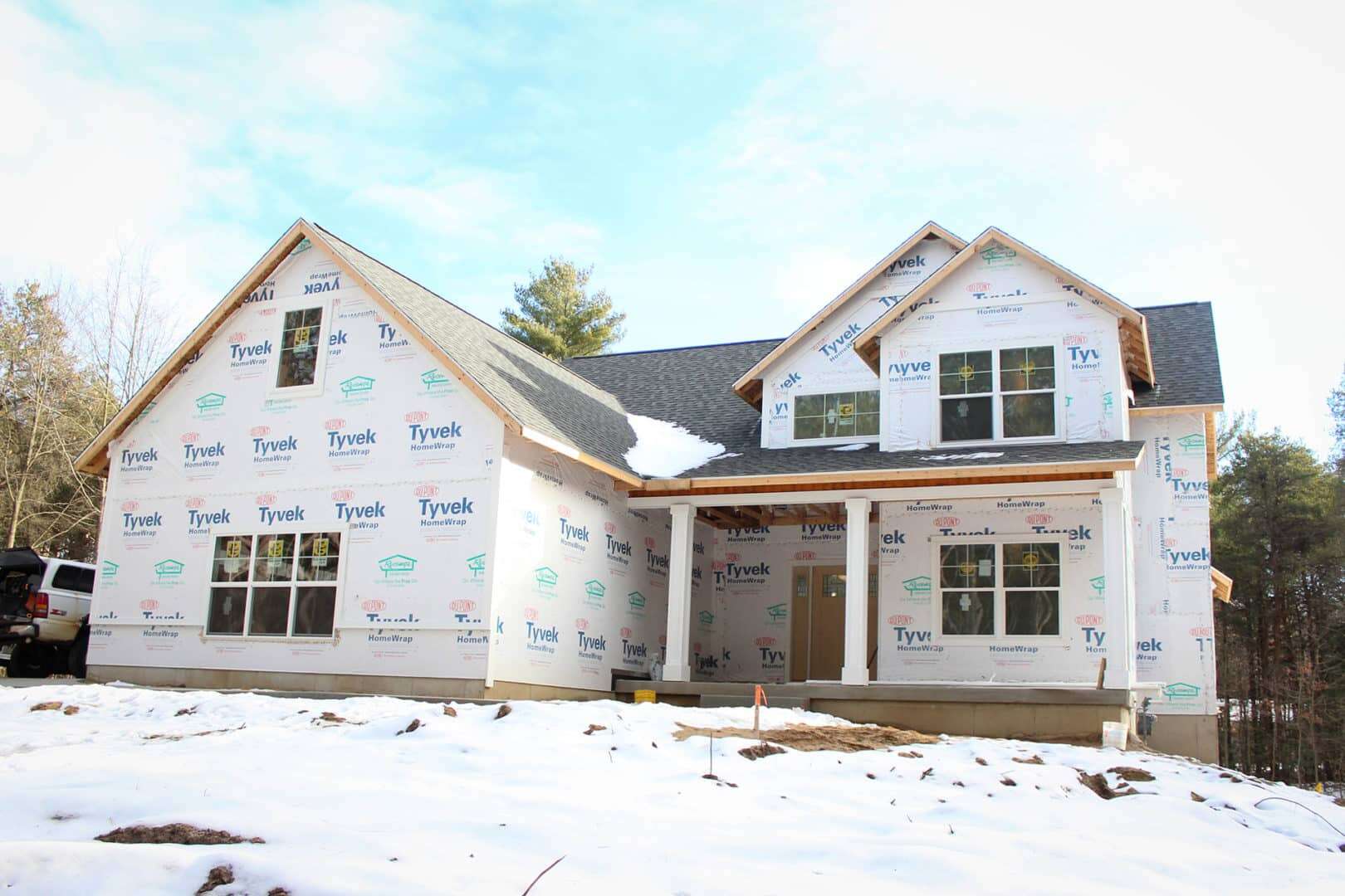 Modern house under construction in Livingston, showcasing durable building materials.