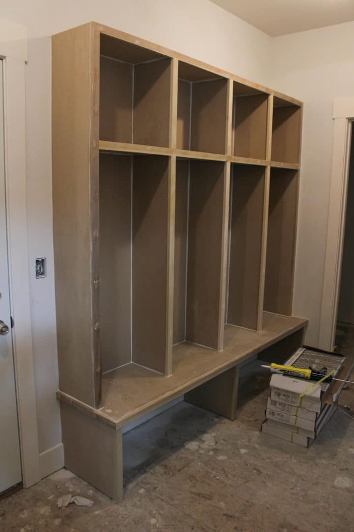 Entryway storage bench with cubbies for shoes and accessories.
