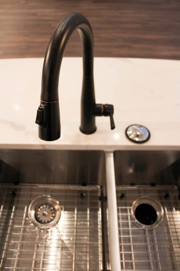 Modern black kitchen faucet with pull-down sprayer.