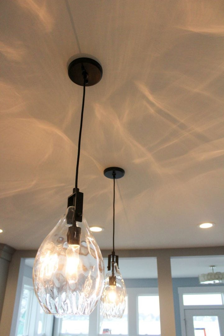Pendant lights hanging from the ceiling with warm illumination.