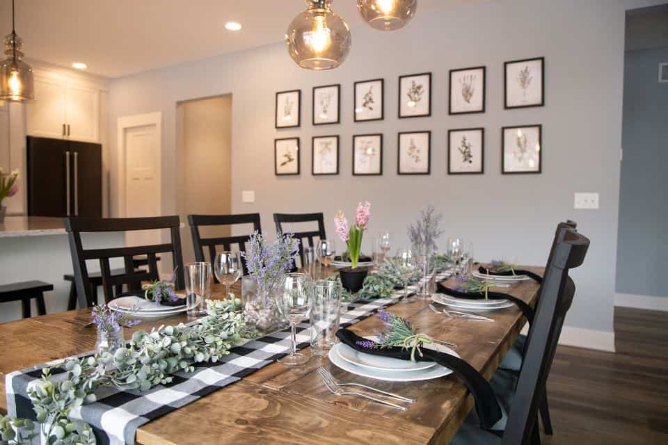 Elegant dining room with floral artwork and stylish decor for family gatherings.