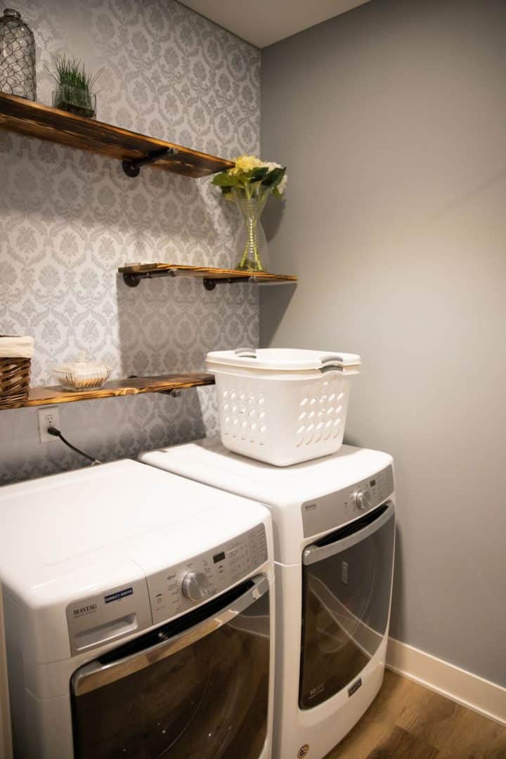 Laundry room with washer and dryer in Livingston Homes.