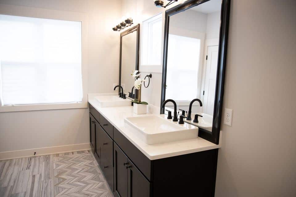 Elegant bathroom vanity with dual sinks and modern fixtures.