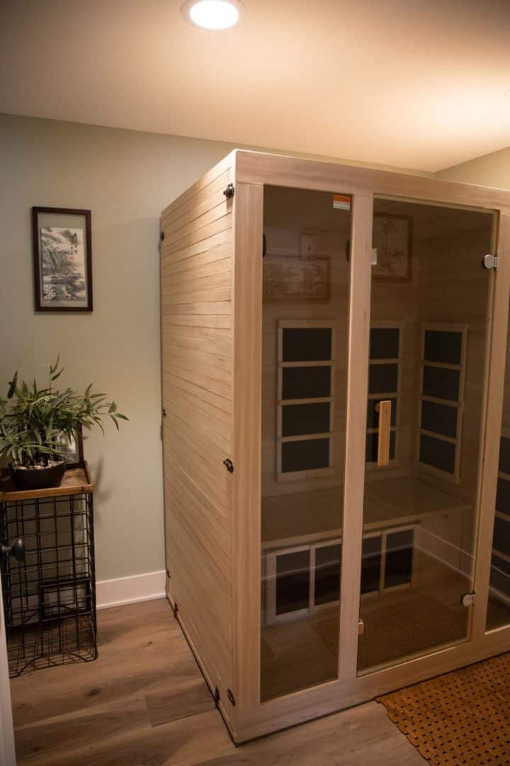 Sauna room with glass doors at Livingston Homes. Perfect for relaxation and wellness in your new hom.