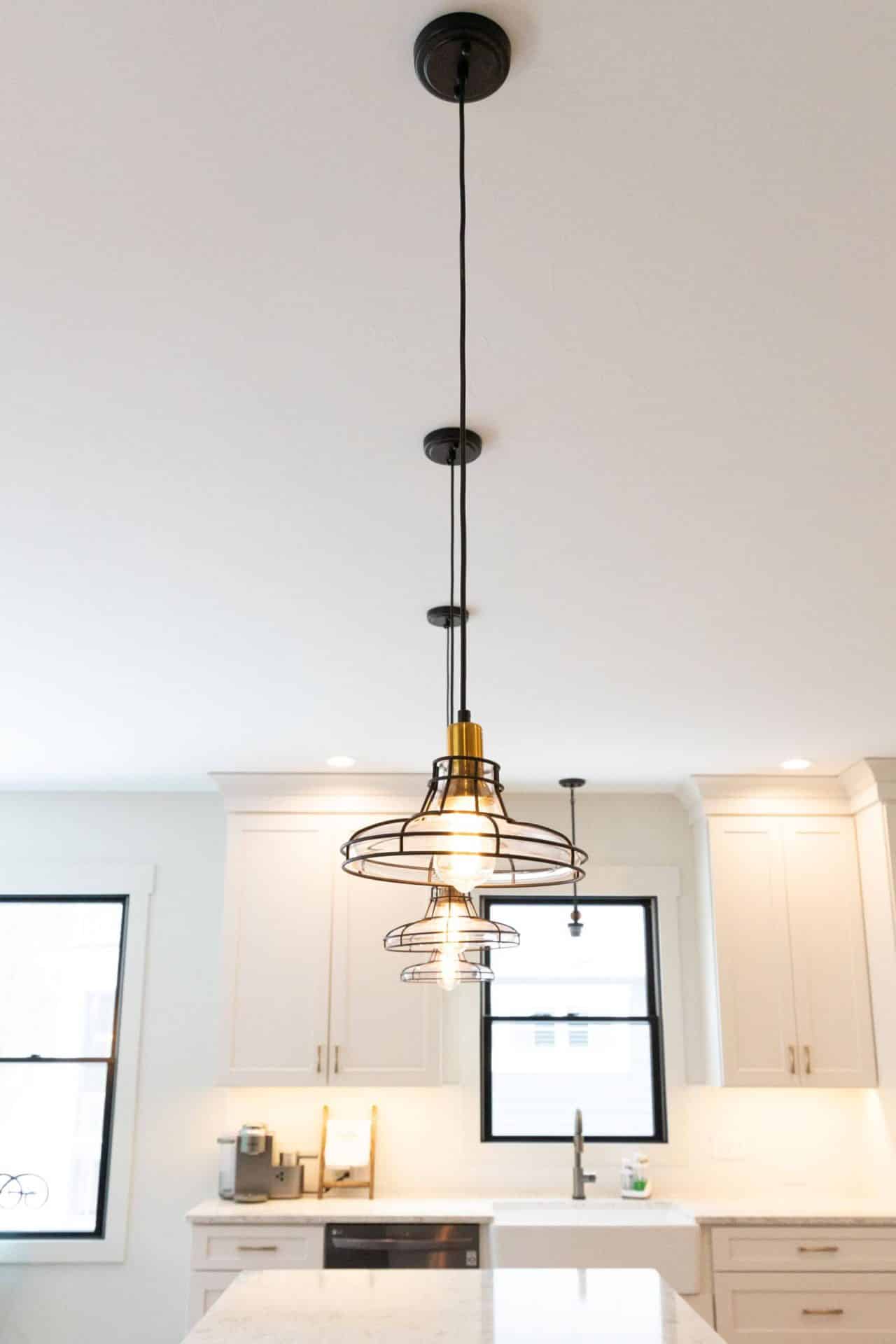 Pendant light fixture with multiple bulbs in a contemporary kitchen.
