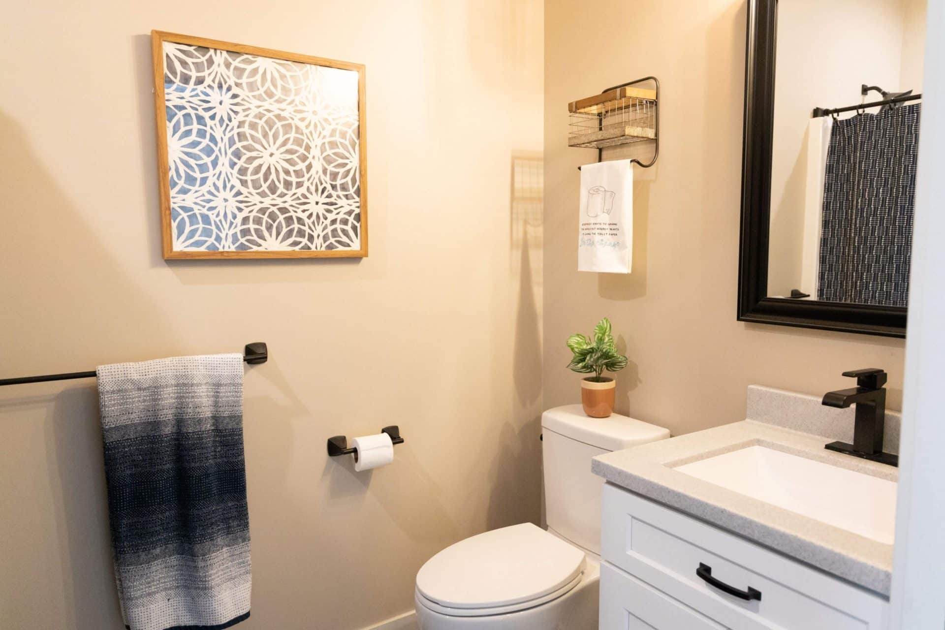 Bright modern bathroom with neutral tones and stylish decor.