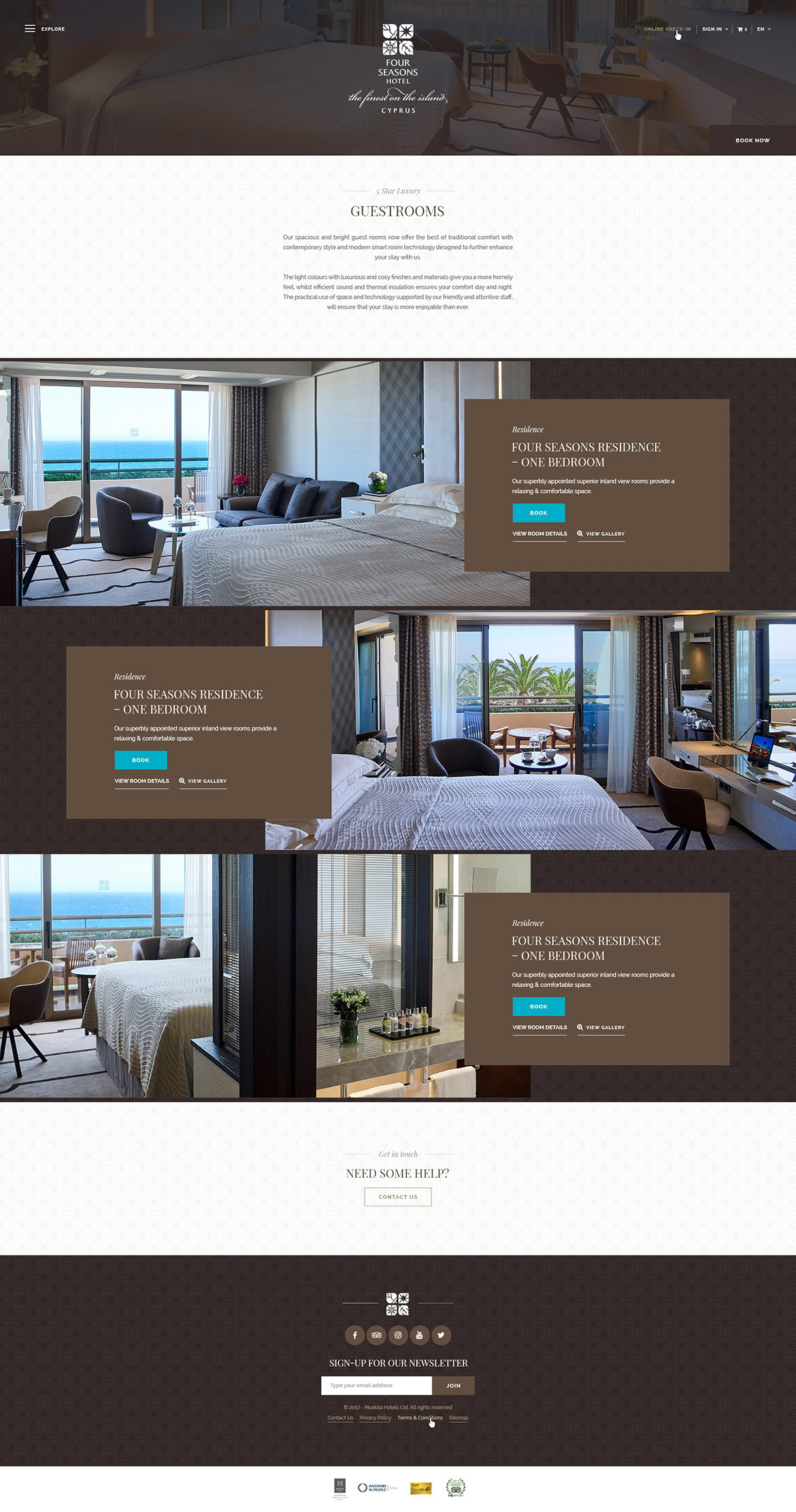 A luxurious hotel lounge and bedroom with large windows, modern furniture, and ocean views.