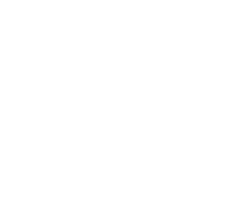 A lush tropical garden surrounds the Four Seasons Hotel Cyprus, with a pool and outdoor seating area.