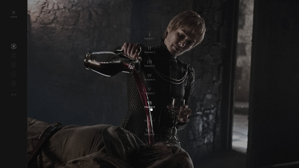 A young man pouring a dark liquid from a bottle into a glass in a dimly lit, industrial-style setting.