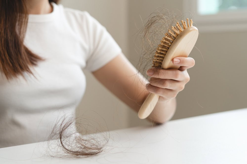 Women experiencing hair loss due to lack of root hair care