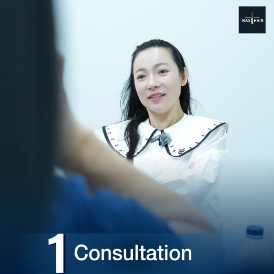 Prospective client at Max Hair Clinic speaks to a doctor during a consultation
