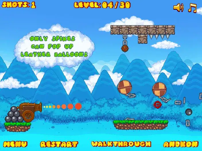 Explosive cannonball game with bouncing balloons and cannon targets on a mountain landscape.