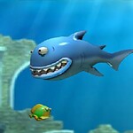 Underwater game with colorful fish and sharks fighting for survival.