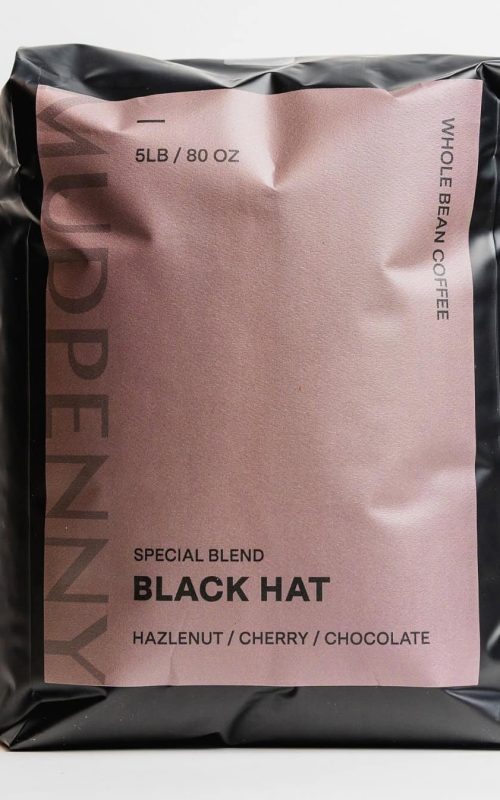 Whole bean coffee bag labeled Black Hat with blend details.