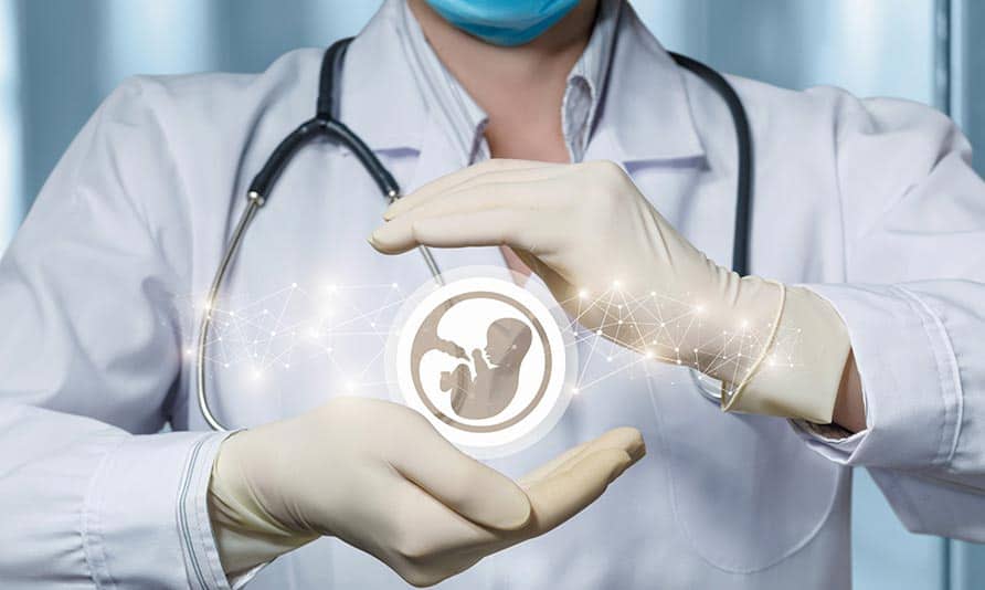 Doctor holding a fetus icon representing fertility preservation.