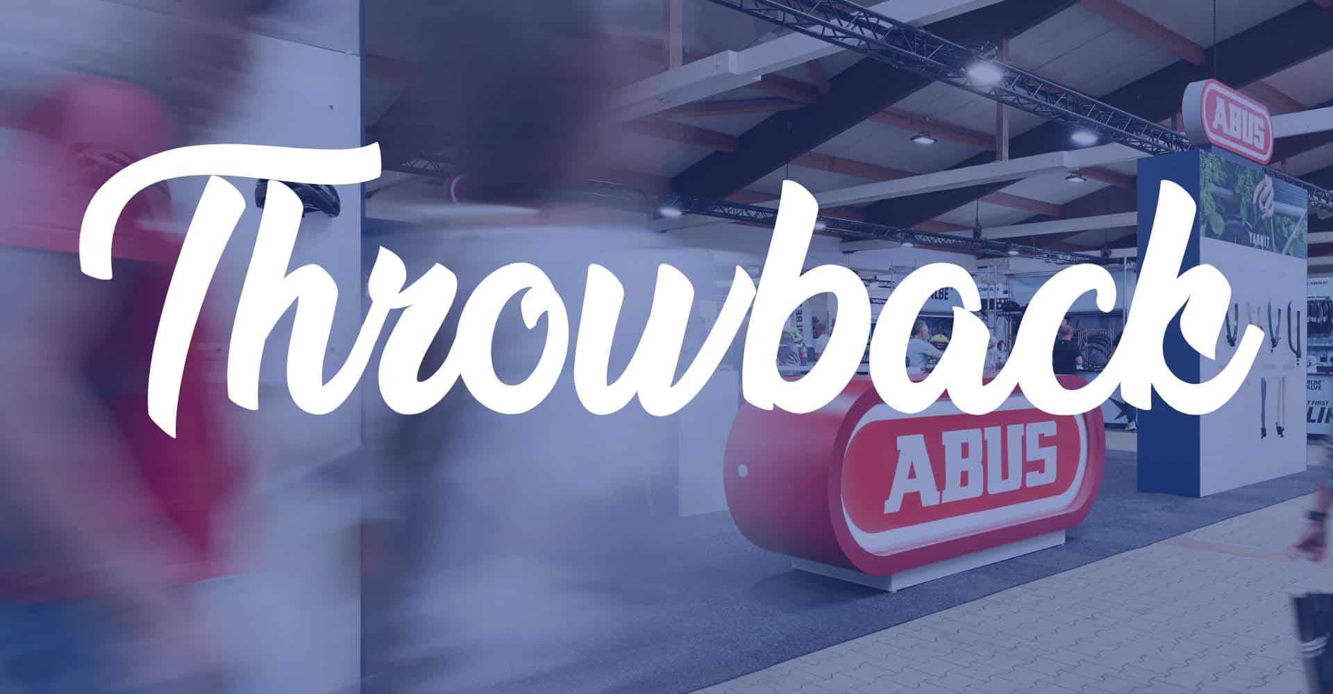 Abus Messestand auf einer Fachmesse mit großem Throwback 2025 Schriftzug.