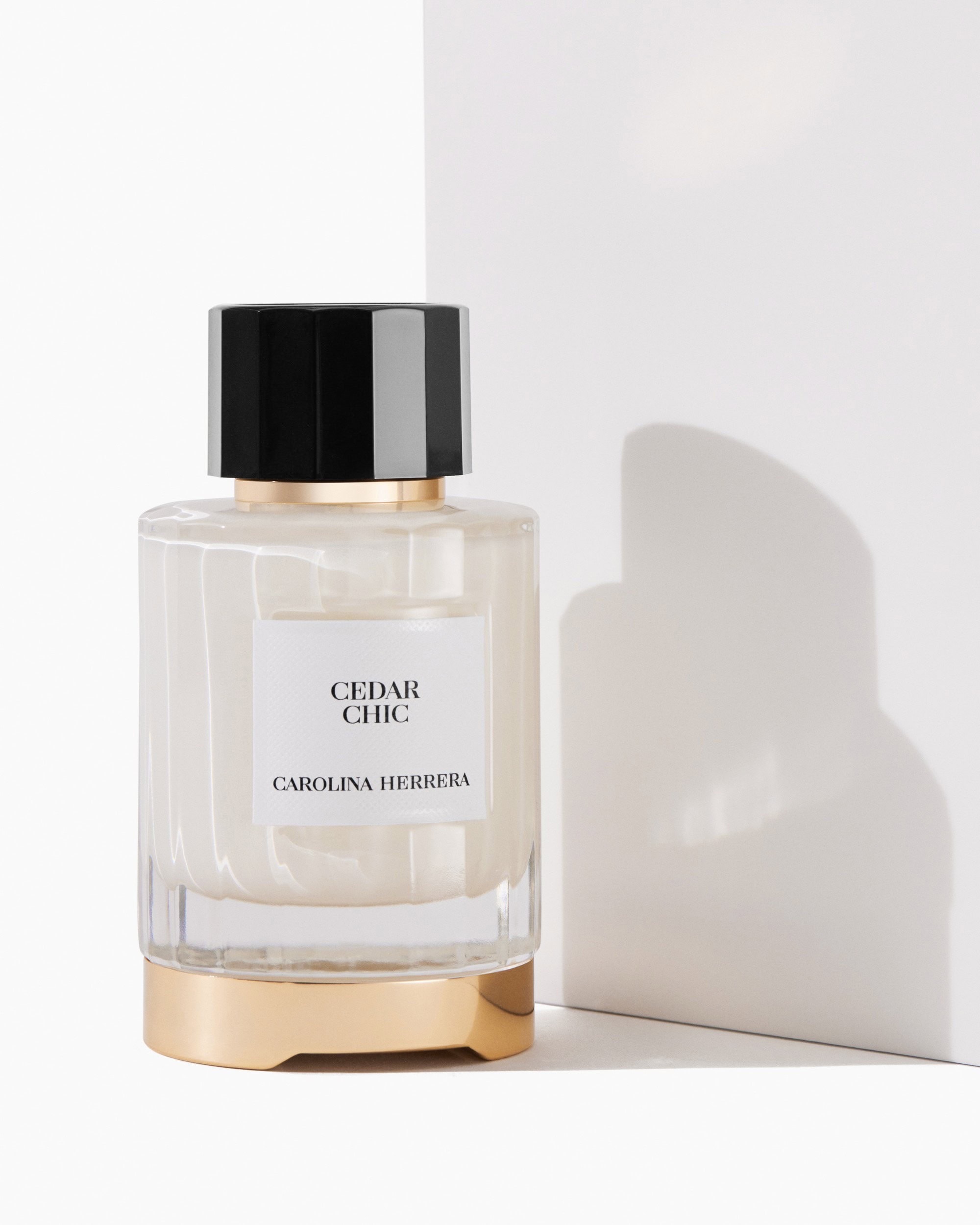 Carolina Herrera Cedar Chic fragrance, a woody floral Eau de Parfum featuring cedarwood, orange blossom, bergamot, and white musk.