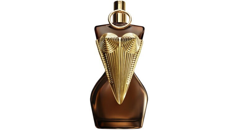 Jean Paul Gaultier Divine Elixir Parfum bottle with amber glass and gold corset design, symbolizing bold femininity and radiant fragrance notes