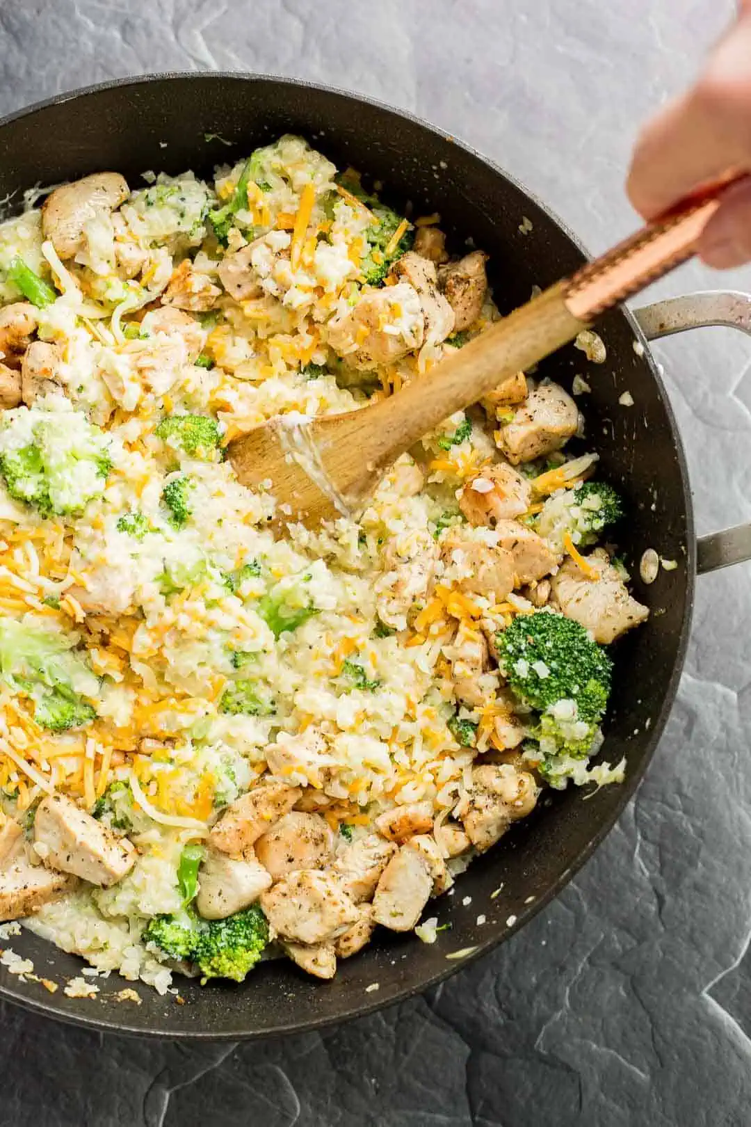 Process shot of mixing together ingredients for a Chicken Broccoli Casserole