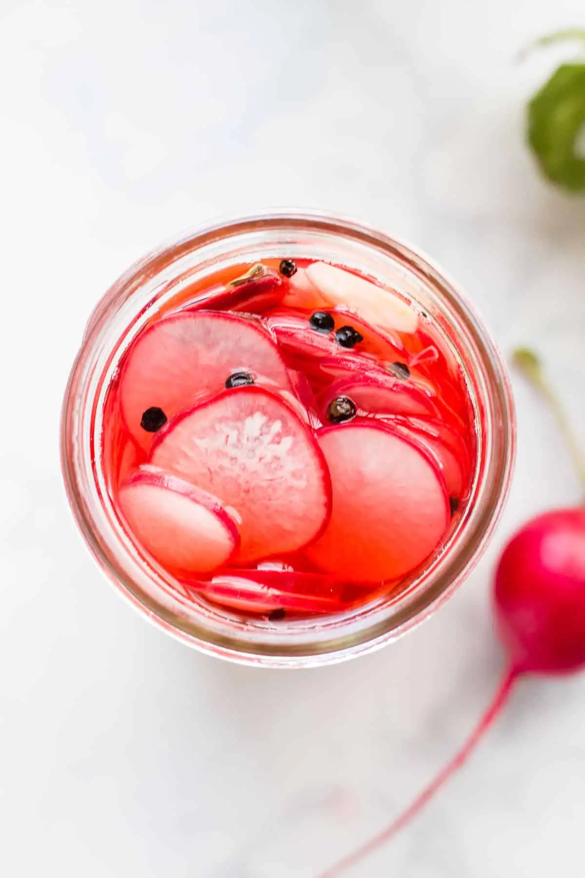 Overhead photo of Refrigerated Pickled Radishes in mason jar