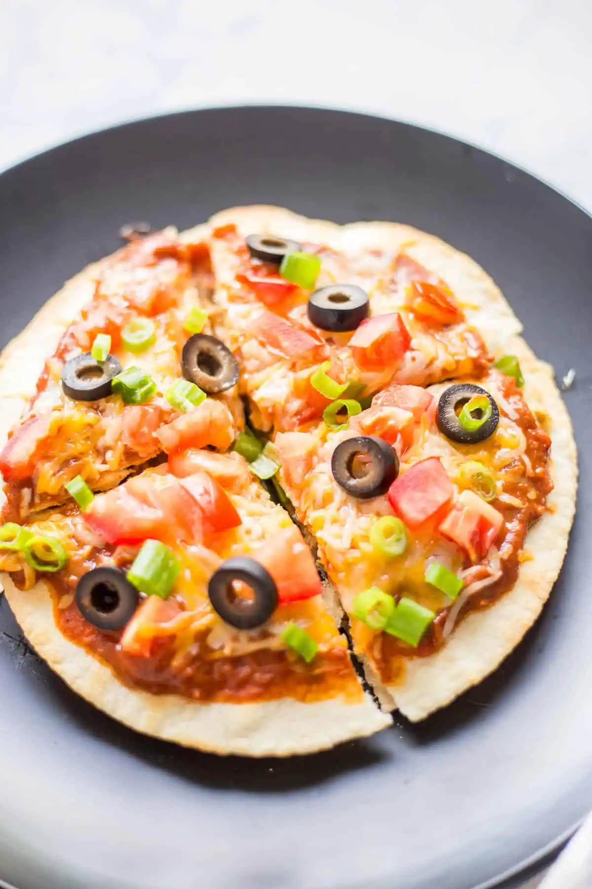 Homemade Mexican Pizza cut into quarters