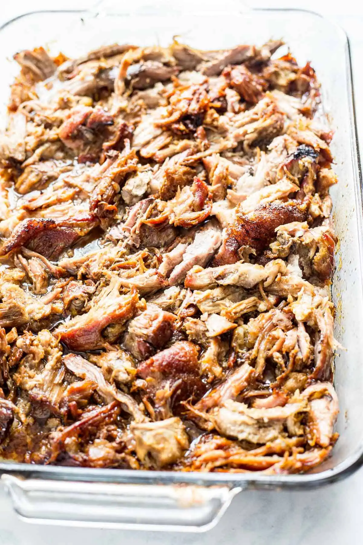 Shredded Pulled Pork Carnitas in a baking dish
