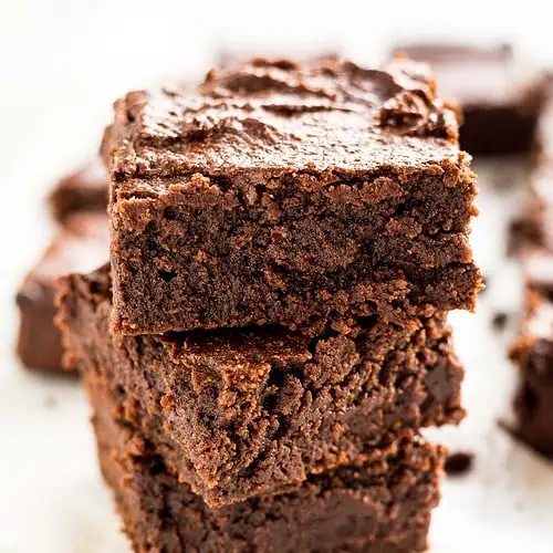 Stacked squares of chewy keto brownies