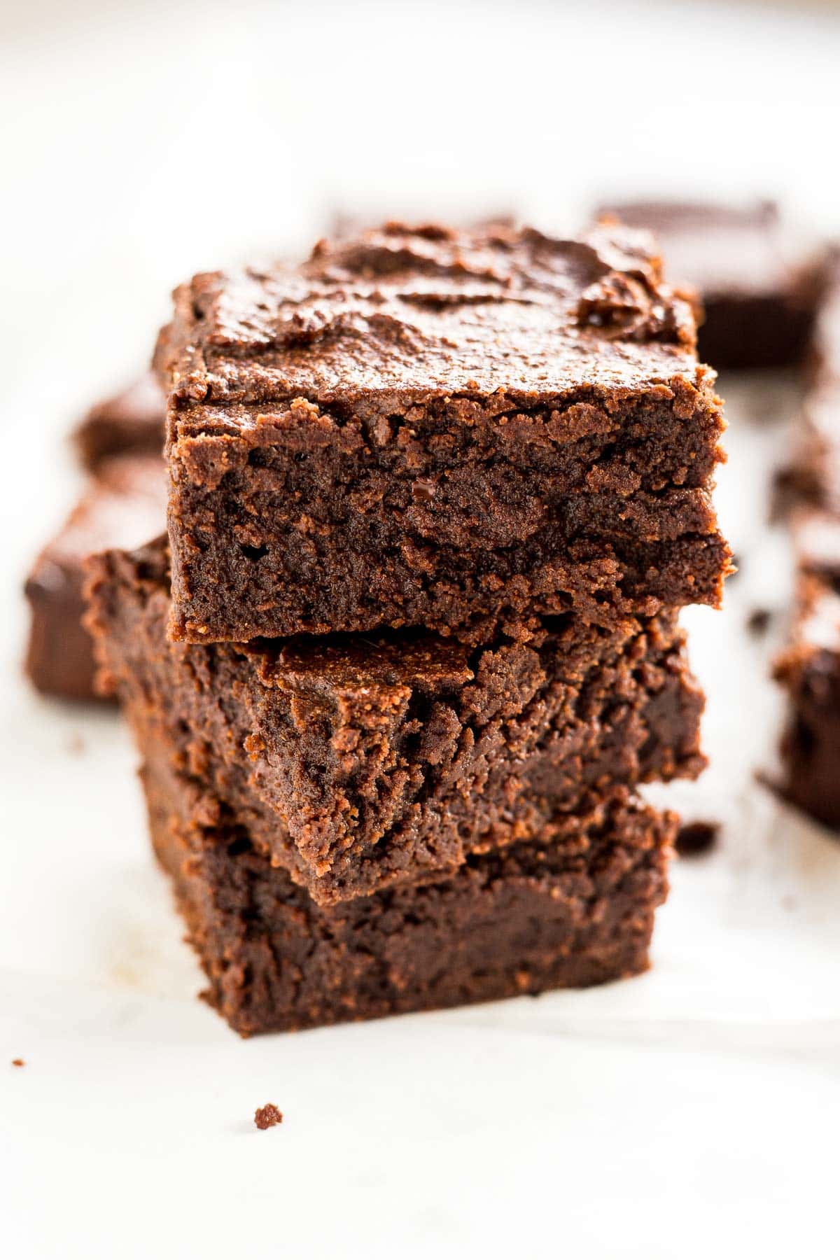 Stacked squares of chewy keto brownies