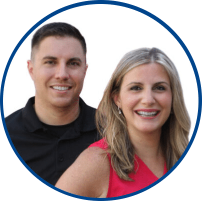 A man in a black shirt and a woman in a pink top stand close together, both smiling, against a white background—showing the warmth that comes when you Plumb it Heat it Cool it right.