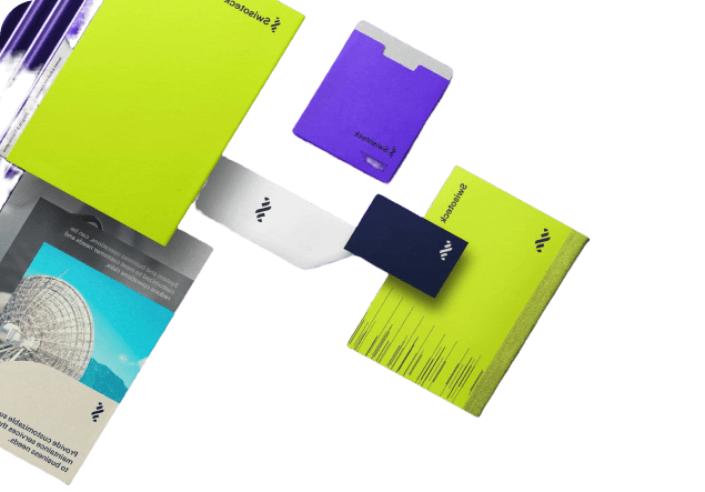 A collection of assorted stationery items including folders, notepads, and business cards in various colors.