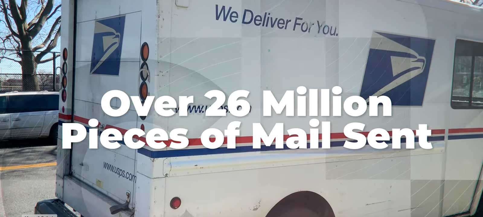 USPS delivery truck with text stating 'Over 26 Million Pieces of Mail Sent'.