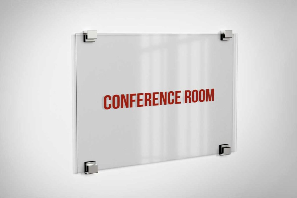 Acrylic panel sign displaying the words 'CONFERENCE ROOM' in red text.