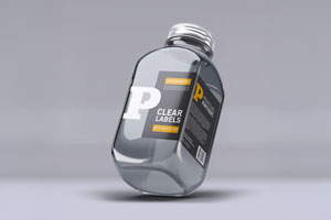 Transparent bottle featuring a clear label with white ink displaying the text 'CLEAR LABELS'.