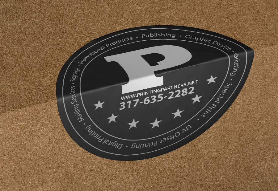 Black oval sticker with a white 'P' logo and contact information for Printing Partners.