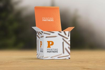 Custom printed tuck boxes featuring the Printing Partners logo and design elements.