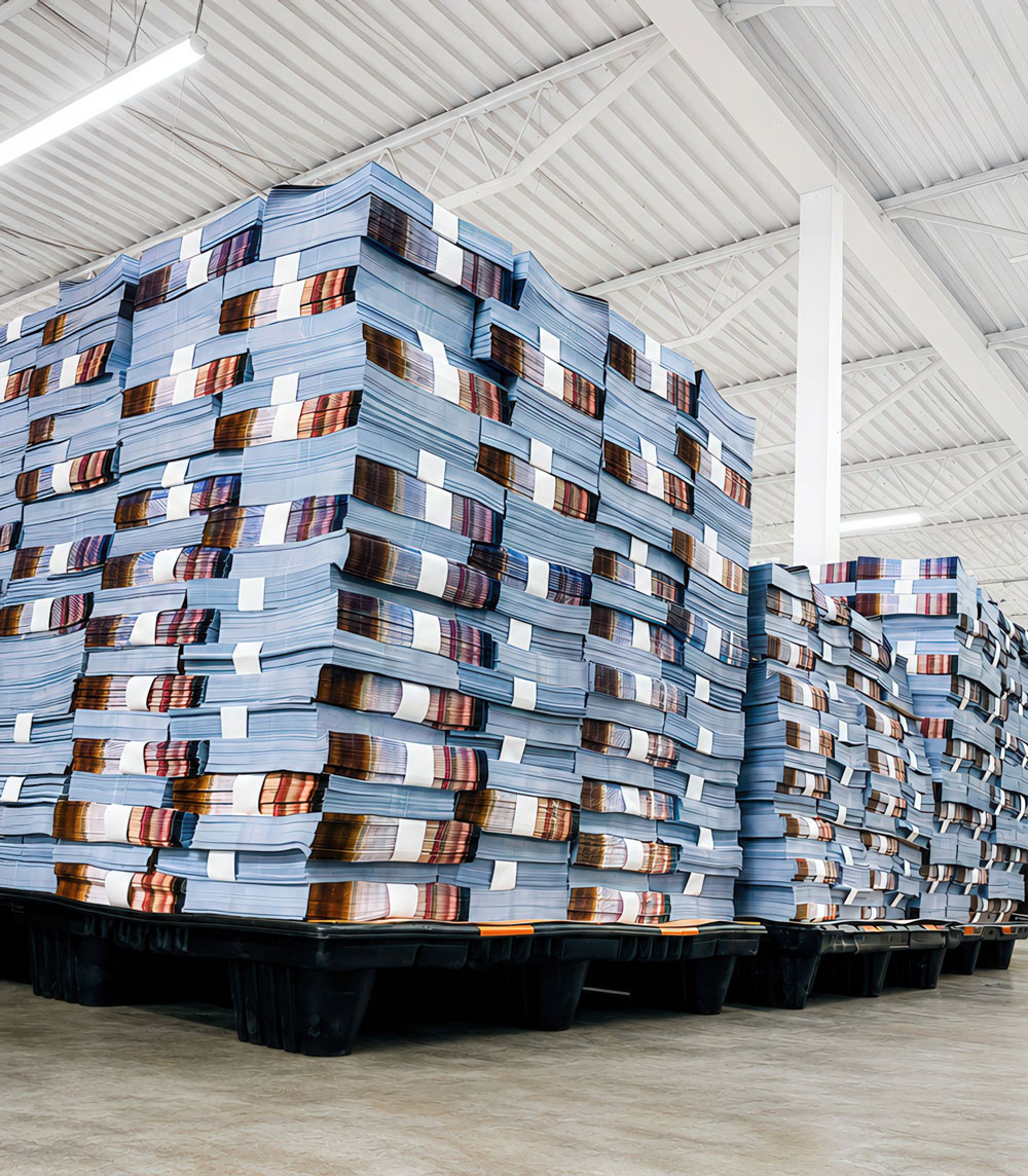Banded stacks of freshly printed documents from a Heidelberg offset run at Printing Partners